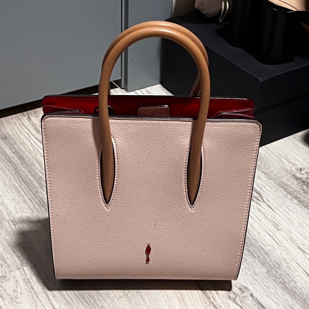 Christian Louboutin Satchel in Pink and Tan with studs on the size.
